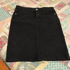 Cookies black denim skirt with belt loops, pockets and tiny slit.